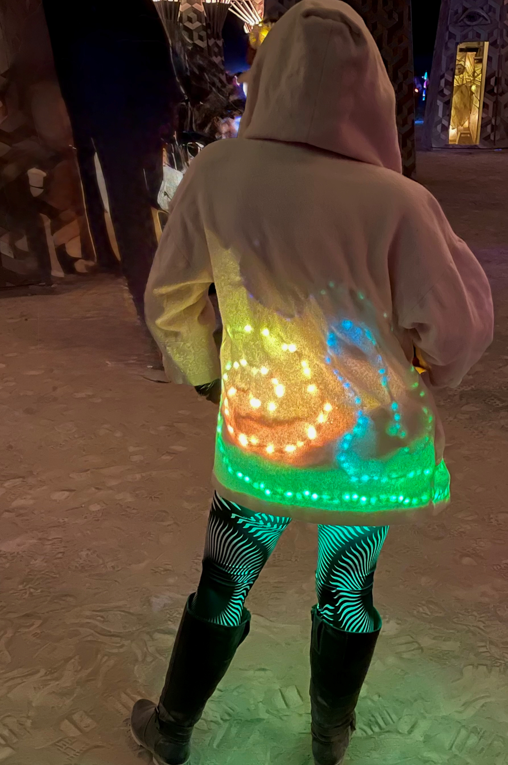 A woman in a white coat with an LED light effect